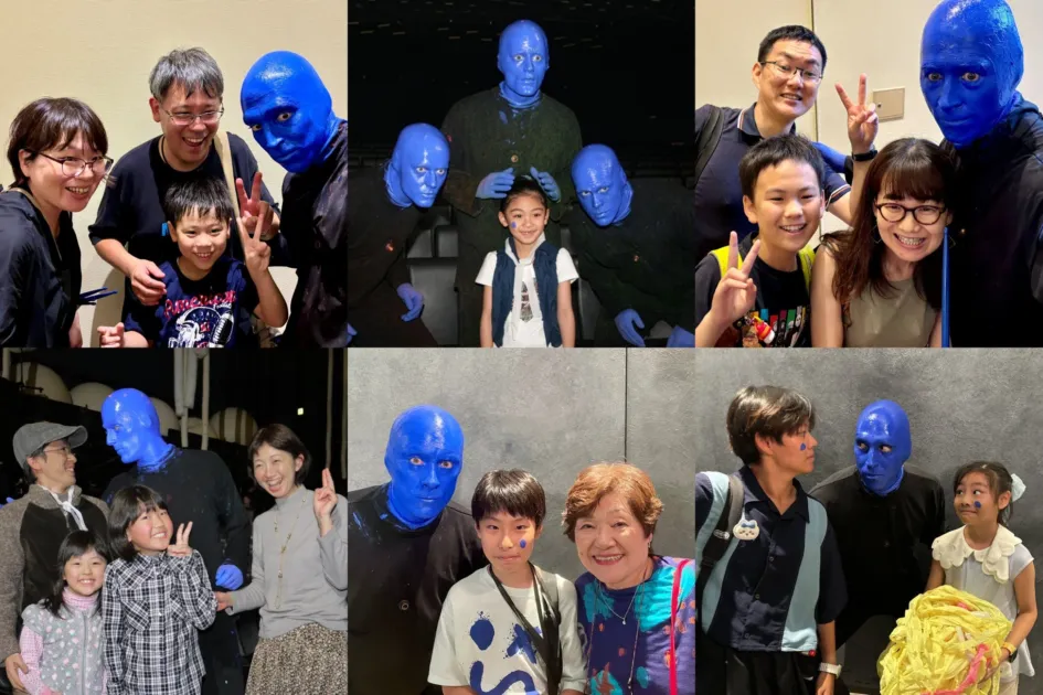 ブルーマングループとファンが交流し、笑顔で記念撮影をする様子