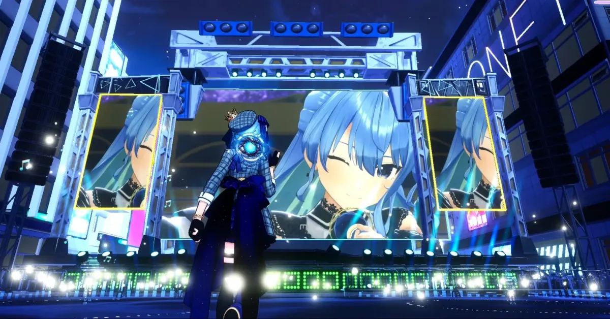青い髪のVTuber「星街すいせい」が映る大型スクリーンと、ステージ上のキャラクターが特徴的なバーチャルライブの光景。