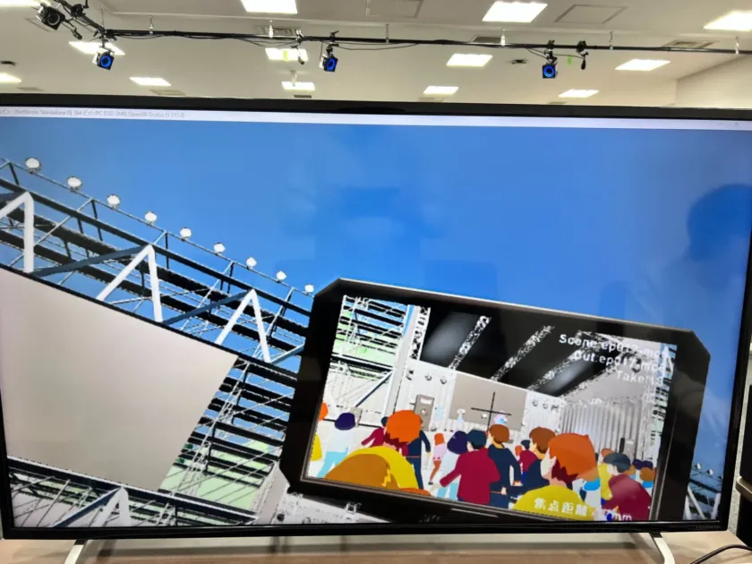 大型ディスプレイに映し出されたVRイベント会場の様子